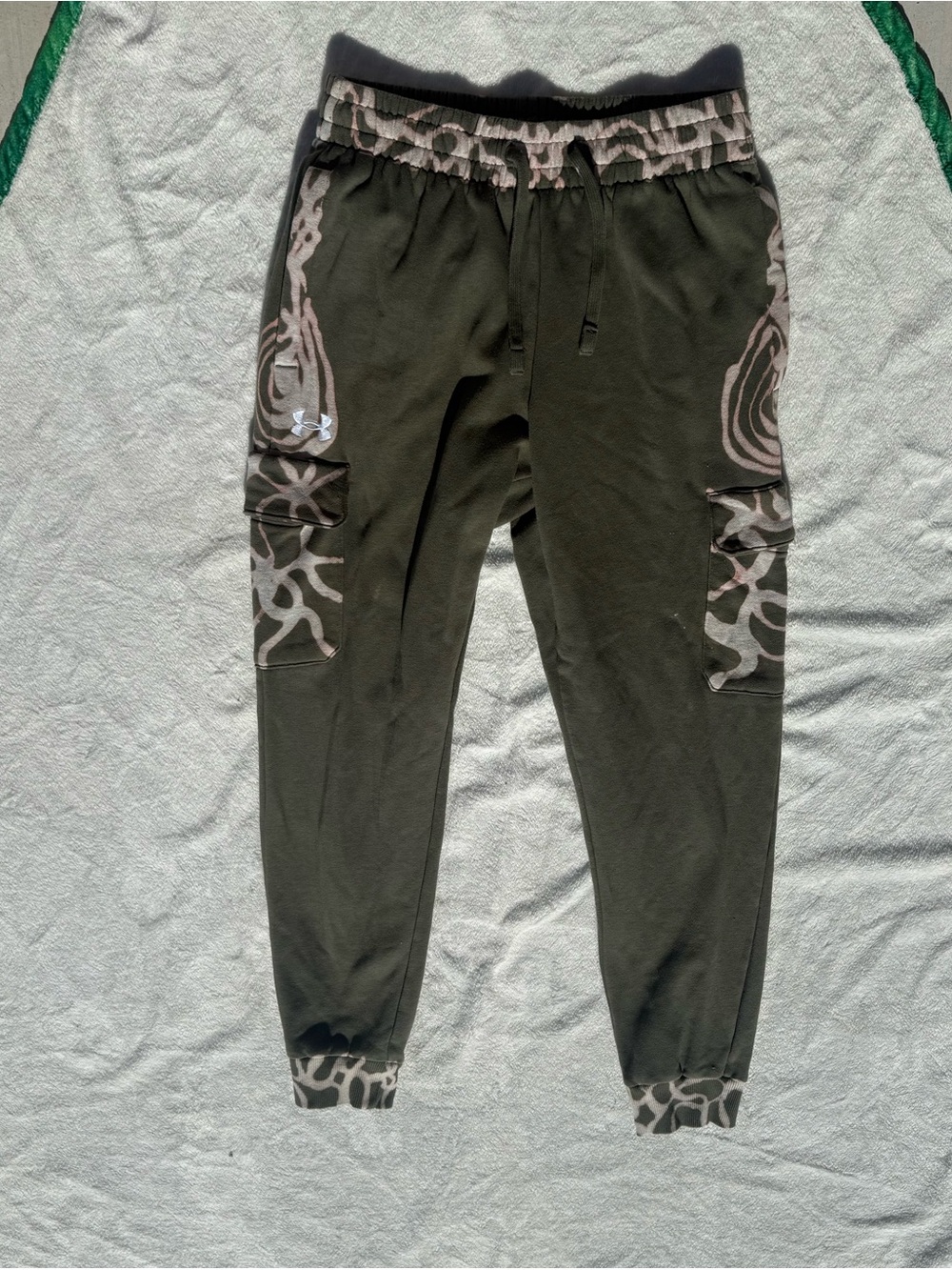 Handpainted jogger pants with an abstract pattern